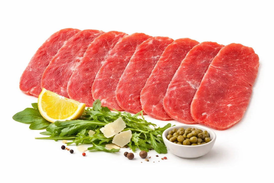Carpaccio di Chianina IGP – Fettine sottili con rucola, scaglie di Parmigiano, capperi e limone