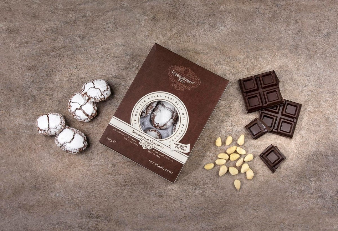 Ricciarelli al Cioccolato Artigianali - Salumeria Toscana Ricciarelli al Cioccolato ArtigianaliFabbrica del PanforteSalumeria Toscana Biscottidolci natalizi toscani, acquista i ricciarelli al cioccolato